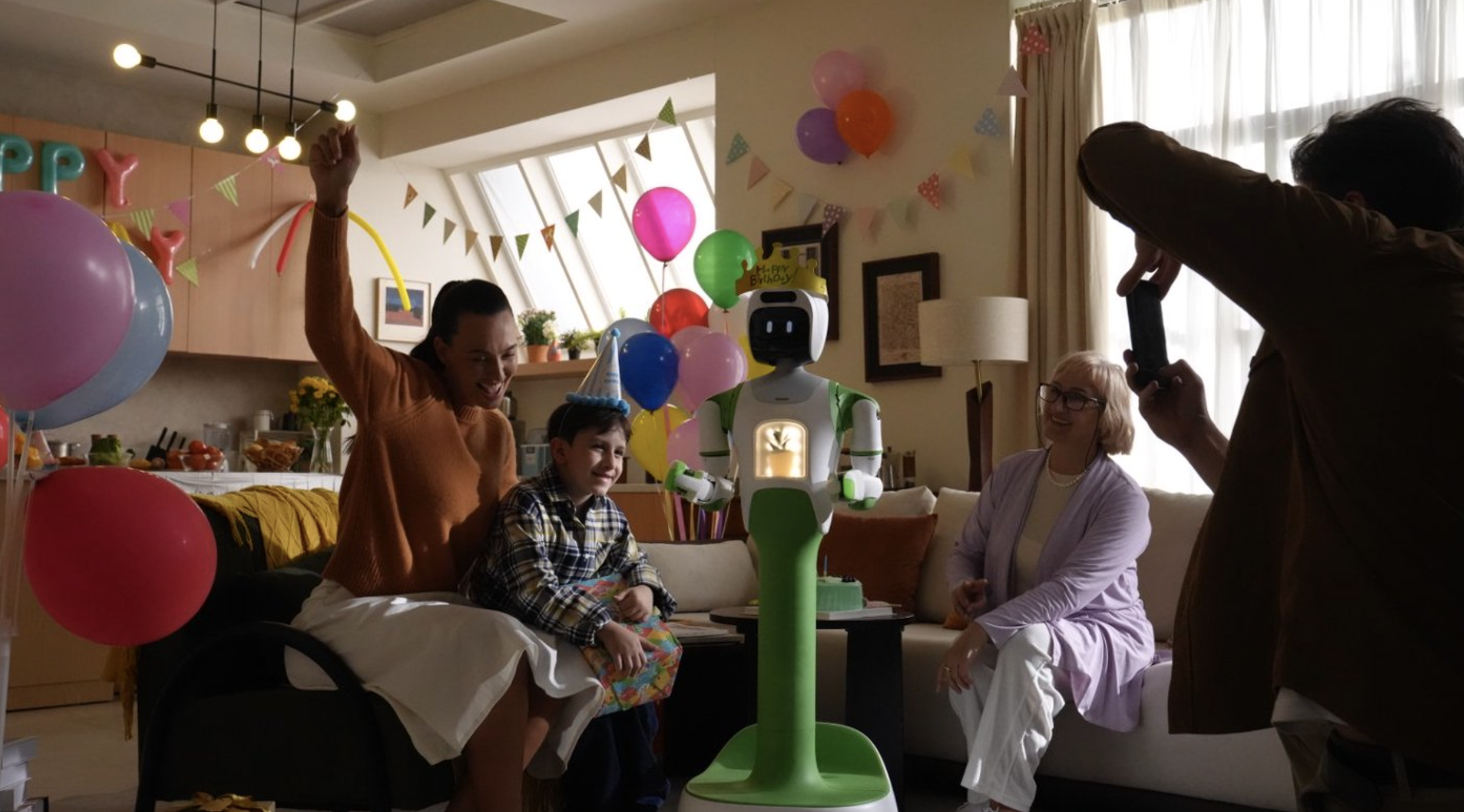 KOKO robot in a family celebration scene.